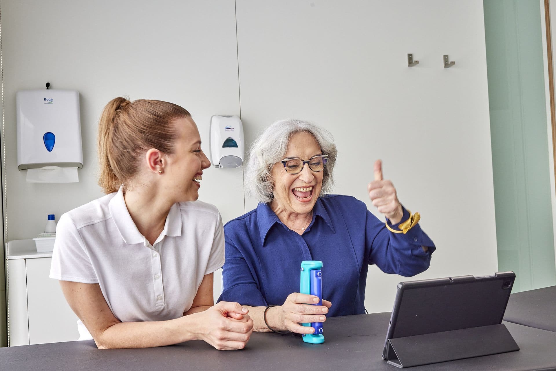 Patient giving thumbs up during functional health assessment