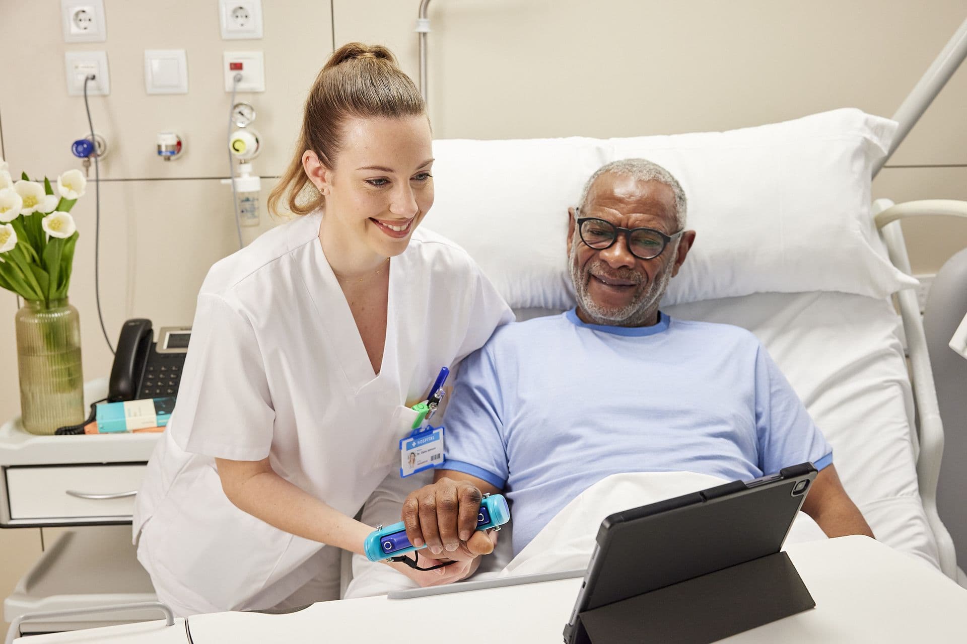 Home health clinician guiding a patient through Able Assess in the home