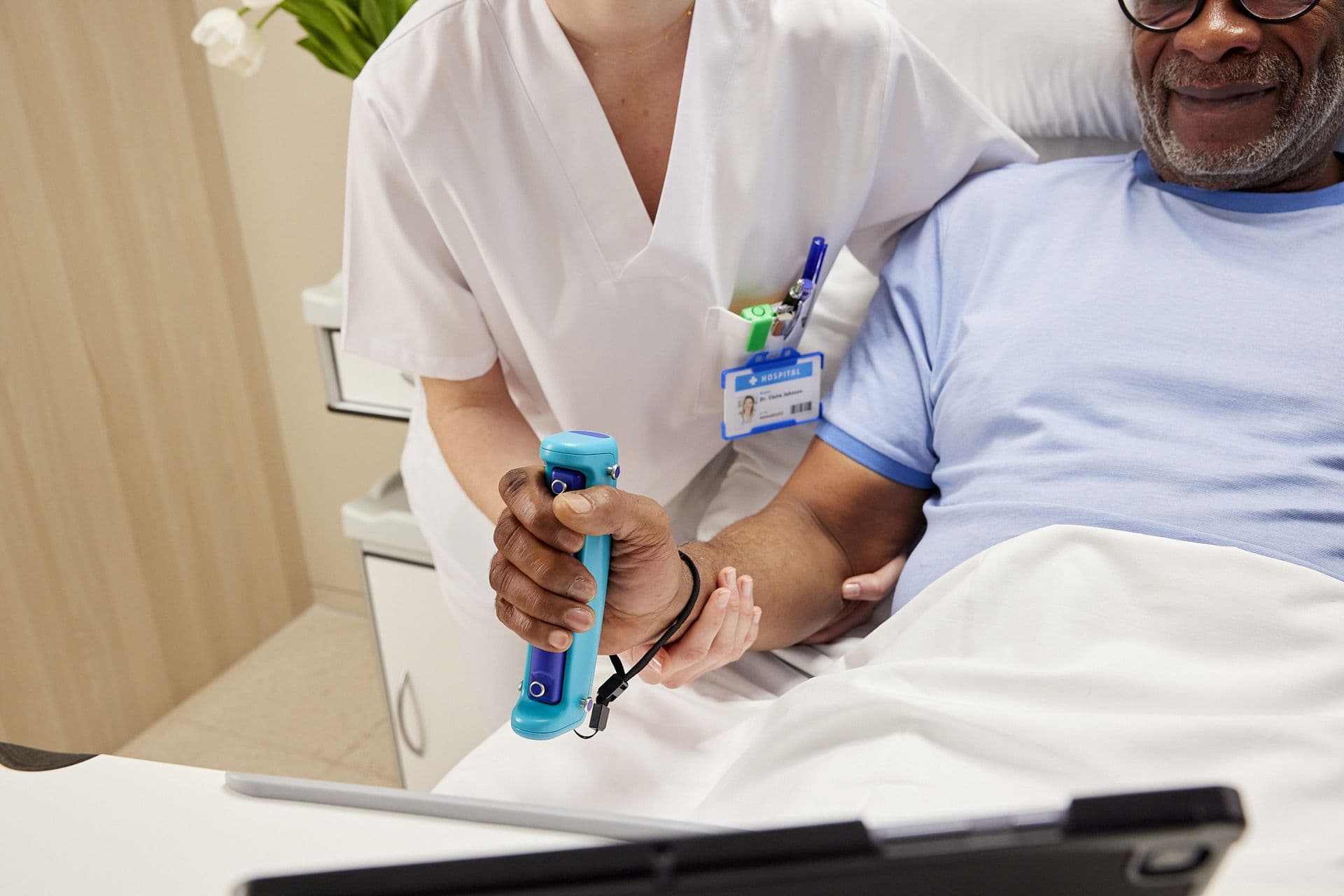 Clinician fitting the GripAble sensor for a patient