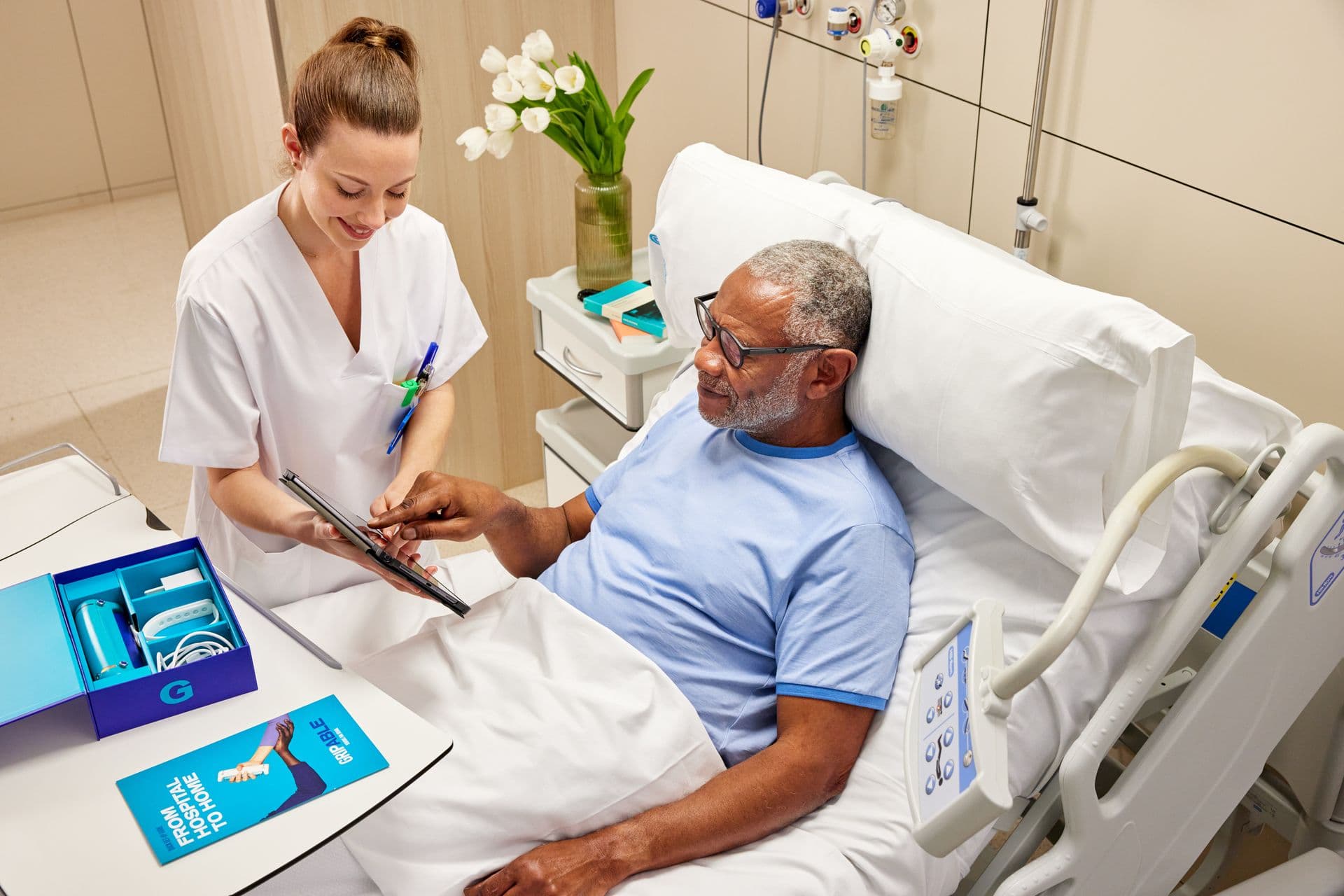 Therapist conducting bedside assessment with patient