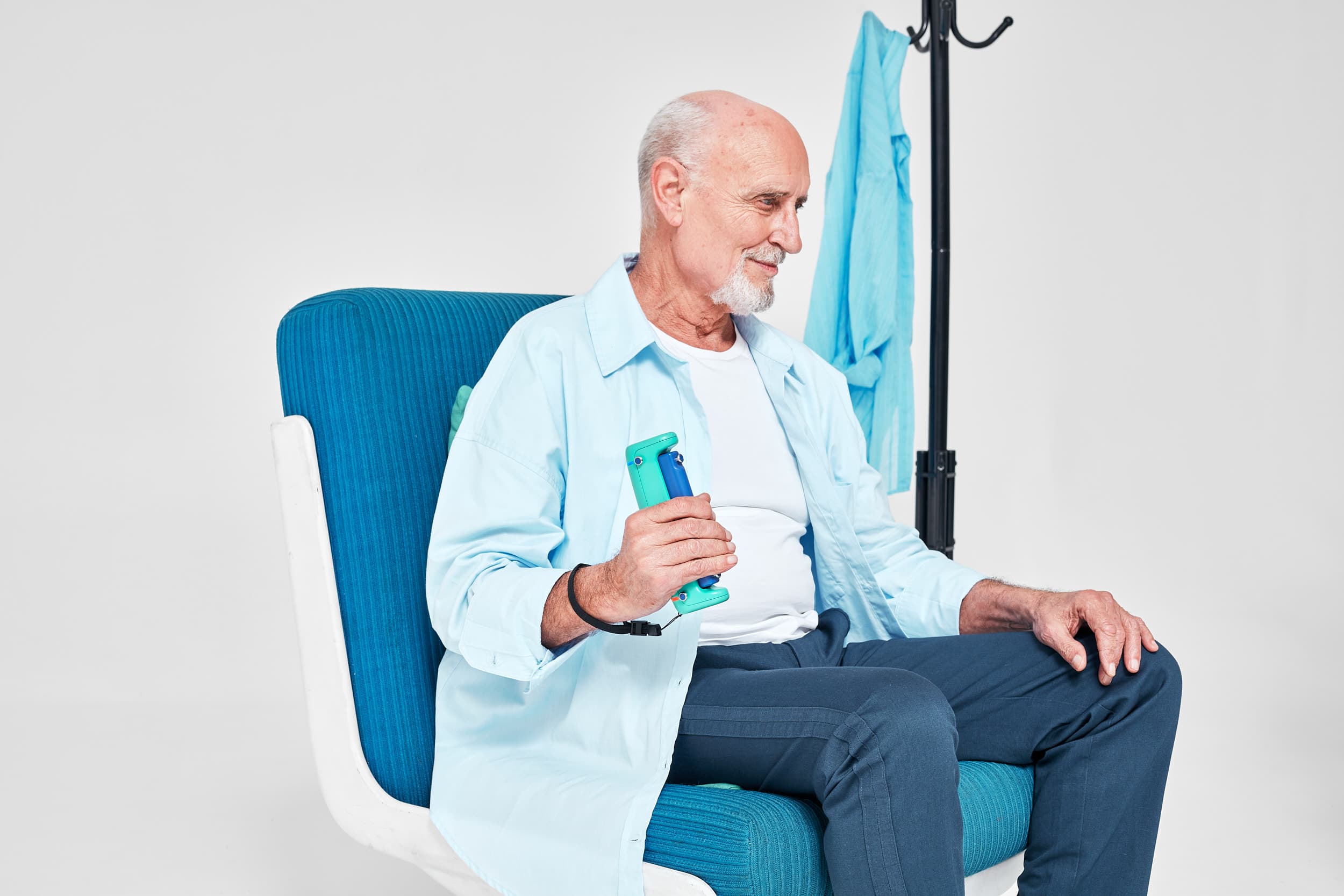 Patient using GripAble grip strength sensor